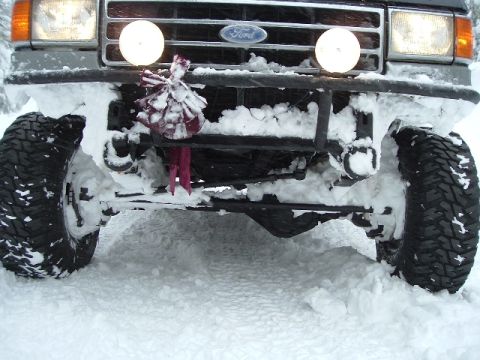 1989 Ford Bronco - the easy way to clean everything under your truck is to just drive into a snow drift till you get stuck and then let it all melt off