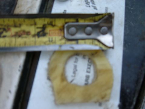 1985 Ford F-150 - A close-up shot shows a measuring tape positioned above a gasket, with some text visible on both items.