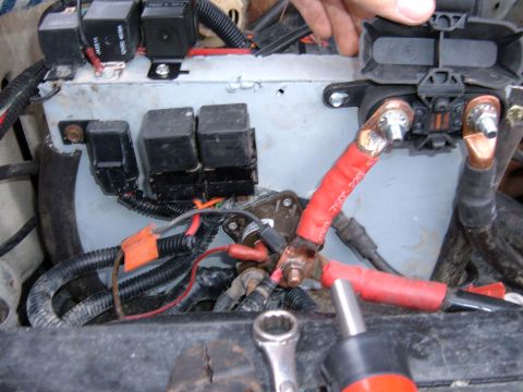 1985 Ford F-150 - A close-up view of a vehicle's electrical system, showing multiple relays and battery connections.
