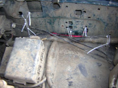 1995 Ford Bronco - Close-up view of engine bay wiring, with zip ties used to manage cables.