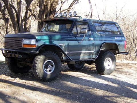 1995 Ford Bronco - This 1995 Ford Bronco features off-road modifications including large tires and a light bar.