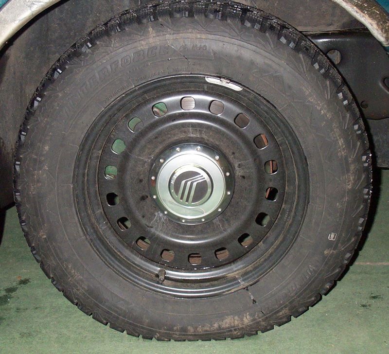 At least the lug nuts are covered....and with a Mercury cap!