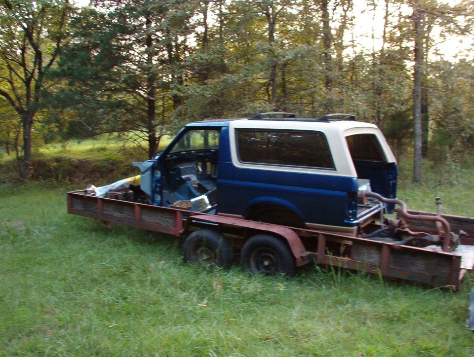 SOLD Body tub, title, & camper shell.  Frame & trailer for sale as-is.  The loose parts inside are also for sale.