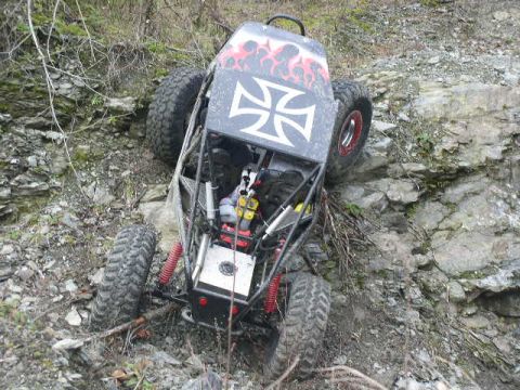 1978 Ford Bronco - This custom off-road buggy navigates a steep, rocky incline, its extreme suspension and tire grip.