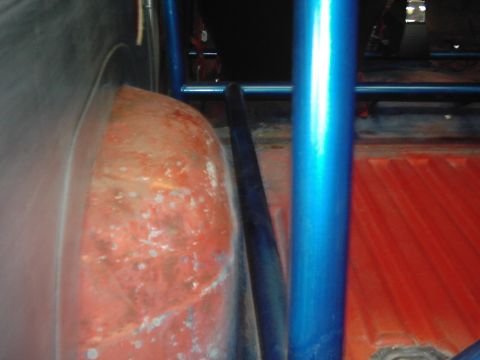 1978 Ford Bronco - Close-up view of a vehicle's interior, showing a roll cage and wheel well.