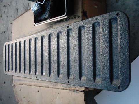 1978 Ford Bronco - A textured panel with raised ridges is shown, possibly a tailgate insert, with a brush and paint tray nearby.
