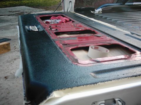 1978 Ford Bronco - Tailgate area of a pickup truck, possibly undergoing a bedliner application.