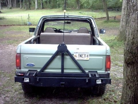 1994 Ford Bronco - Custom made rear bumper with swing away tire/fuel can carrier.
