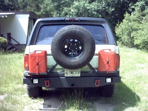 1994 Ford Bronco - Spare tire and fuel cans installed.