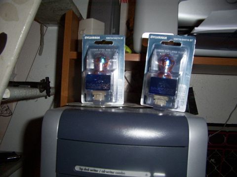 1998 Mercury Sable - Two Sylvania Silverstar bulbs are packaged and displayed on top of a printer.