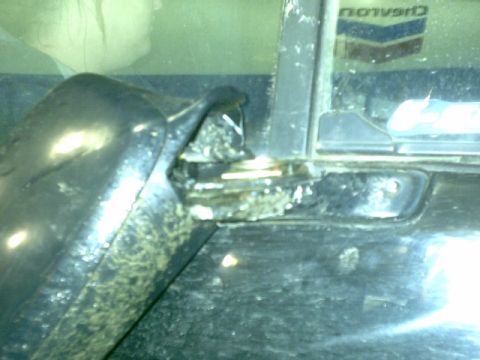 1995 Ford Bronco - Damage is visible on the door frame of this vehicle, with a reflection in the window.