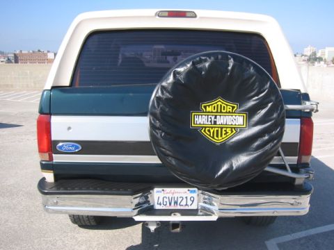 1992 Ford Bronco - Rear view of a 1992 Ford Bronco, a Harley-Davidson spare tire cover and a California license plate.