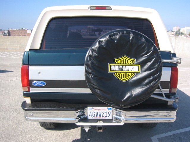 1992 Ford Bronco rear view with Harley-Davidson spare tire cover and California license plate 4GVW219
