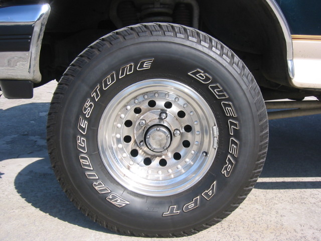 Bridgestone Dueler A/T tire on a polished aluminum hole-pattern truck wheel