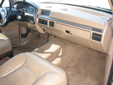 1992 Ford Bronco - Interior view of a 1992 Ford Bronco, tan upholstery and dashboard details.