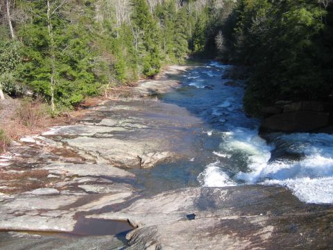 1985 Ford LTD Crown Victoria - A scenic view of a river cascading over rocks in a wooded area.