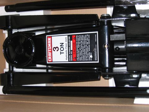 1985 Ford LTD Crown Victoria - A Craftsman 3 ton hydraulic floor jack is shown in its packaging.