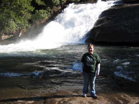 1985 Ford LTD Crown Victoria - A person poses for a photo in front of a cascading waterfall.