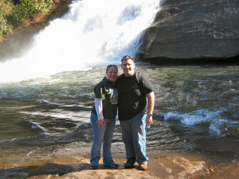 1985 Ford LTD Crown Victoria - A couple poses for a photo in front of a cascading waterfall.