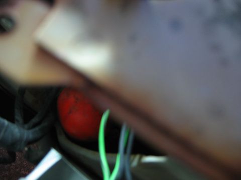1985 Ford LTD Crown Victoria - A blurry shot shows a red, spherical object with electrical wiring.