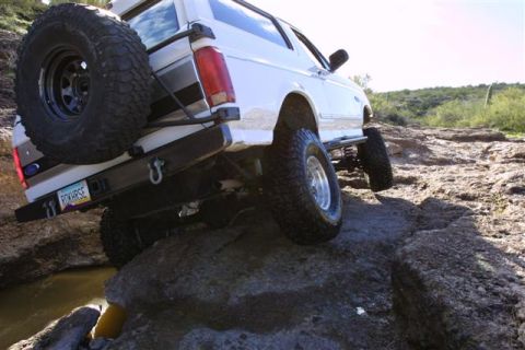1994 Ford Bronco - This 1994 Ford Bronco tackles a challenging off-road course, its capabilities and iconic body style.
