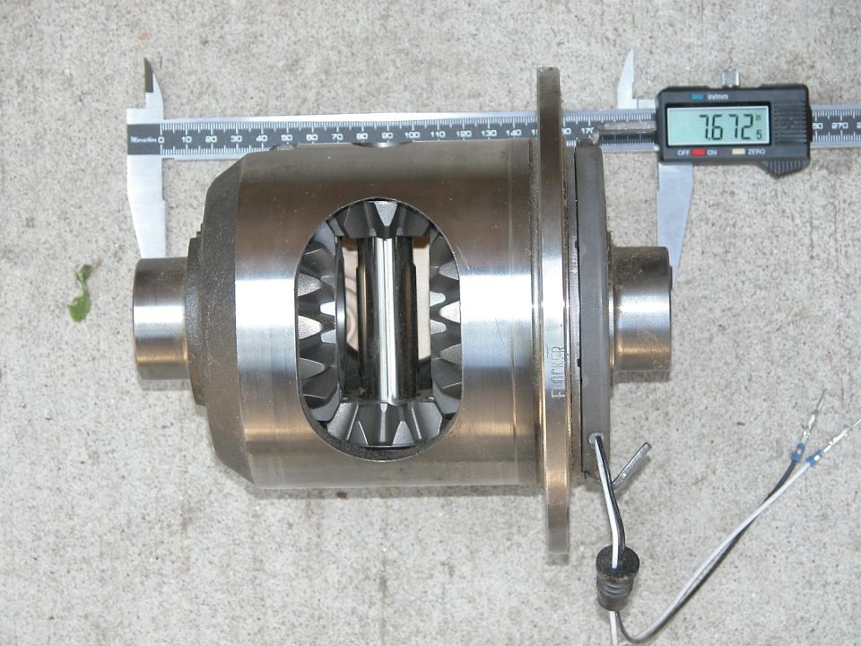 Differential locker carrier measured with digital caliper reading 7.672 inches on concrete