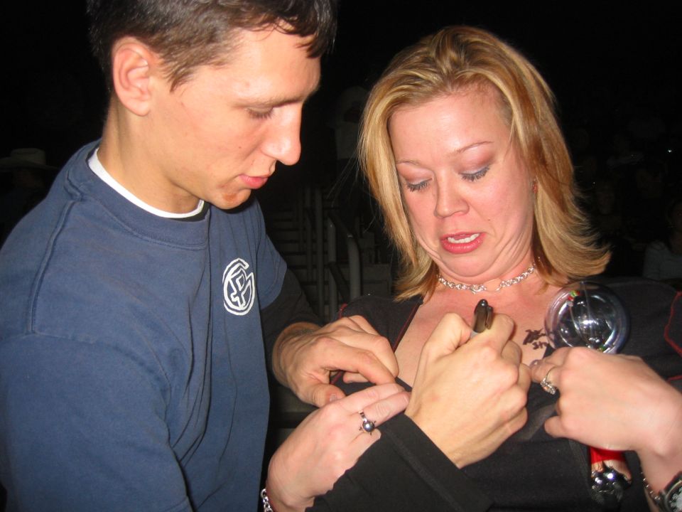 Ahh...now I get it. They are whores, and were getting people to sign their boobs. I begrudgingly obliged.