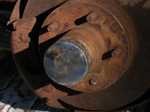 1990 Ford Bronco - Close-up of a rusted brake rotor and hub assembly, likely from an older truck or SUV.