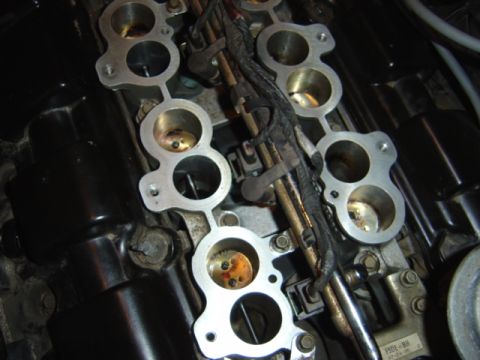 1998 Ford Taurus - Close-up view of an engine's intake manifold, showing the ports for air intake.