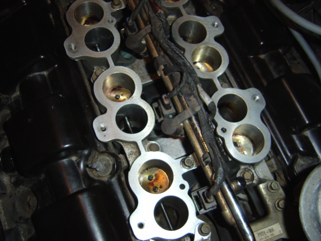 Engine intake manifold with four ports visible