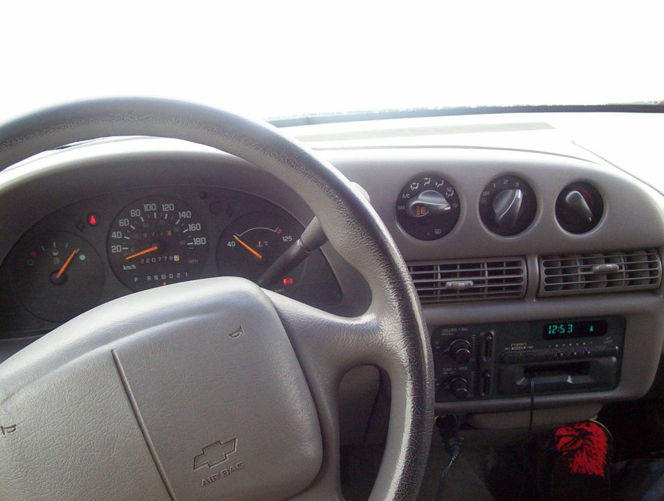 Chevrolet Lumina gray dashboard and airbag steering wheel, odometer near 220,778, factory cassette radio