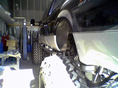 1995 Ford Bronco - This lifted truck features oversized off-road tires and a two-tone paint scheme.