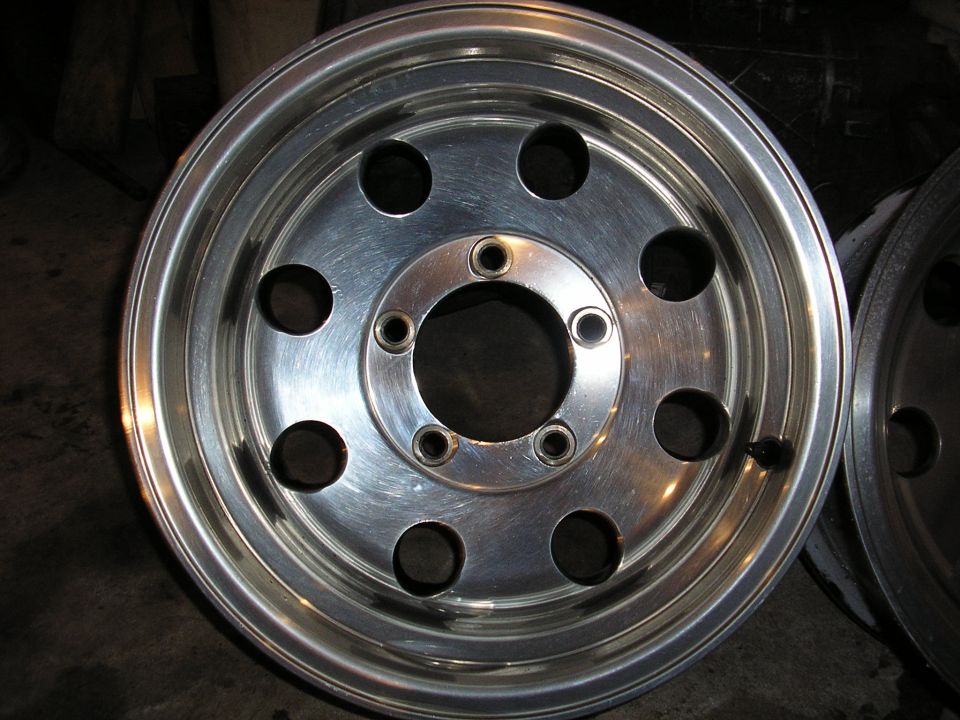 Aluminum wheel with ten lug holes and a polished finish