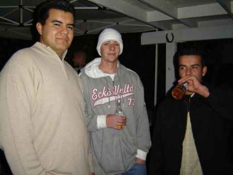 2000 Ford F-450 - Three men pose for a photo while gathered outdoors at night.