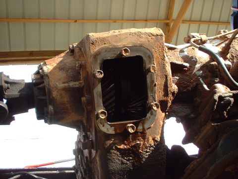 1976 Ford F-150 - Close-up of a heavily rusted truck transmission, showing internal gears.