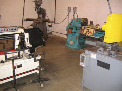 1978 Ford Bronco - A workshop scene displays various industrial machines, including lathes and a milling machine, under fluorescent lighting.