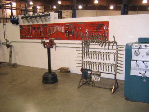 1978 Ford Bronco - A workshop scene displays organized tools and machinery, suggesting a vocational training environment.