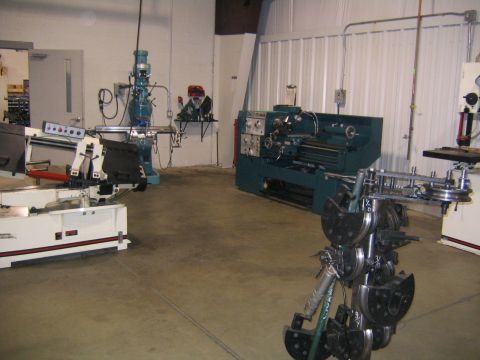 1978 Ford Bronco - This image shows a workshop filled with various industrial machines, including lathes and milling equipment.