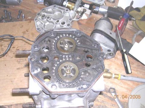 1994 Ford Bronco - The fittings and top removed, this is what i am calling the cylinder cover plate. It has a gasket above and below. I had to remove this pla…