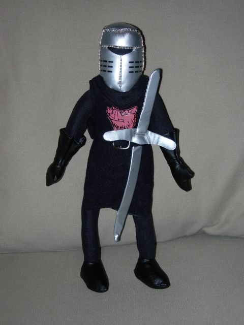 1995 Ford Bronco - Plush toy knight with silver helmet and sword is displayed against a neutral background.