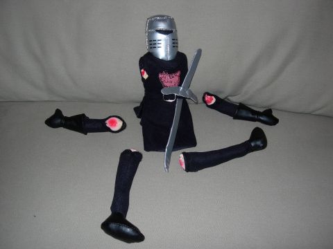 1995 Ford Bronco - A toy knight figure is shown disassembled with its limbs separated from the torso.