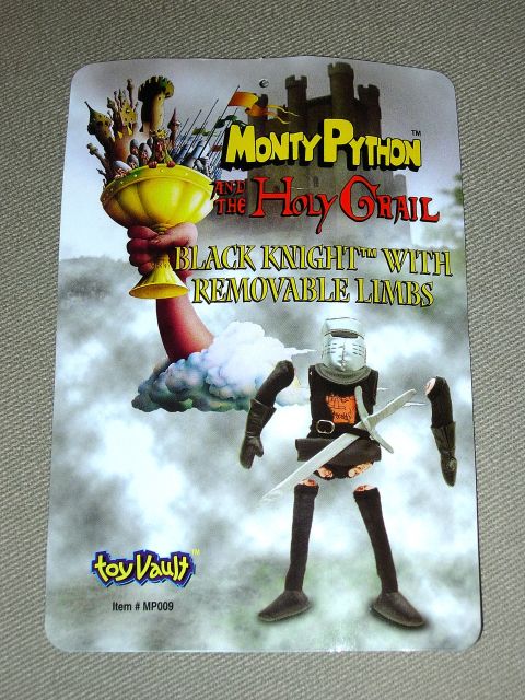 1995 Ford Bronco - Packaging for a Monty Python Black Knight toy depicts the character and the Holy Grail with a castle in the background.