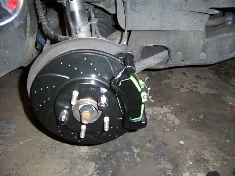 1998 Mercury Sable - Close-up of a custom painted brake caliper and rotor assembly.