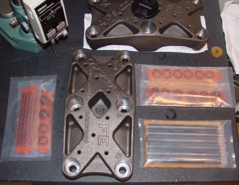 1969 Ford Fairlane - Engine components and hardware laid out on a workbench, possibly for inspection or assembly.