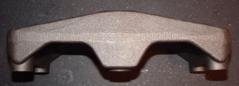 1969 Ford Fairlane - A metal casting part, possibly an engine component, is shown against a dark background.
