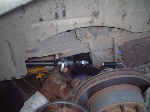 2000 Ford Excursion - Installation of a suspension component on the rear axle of a vehicle.
