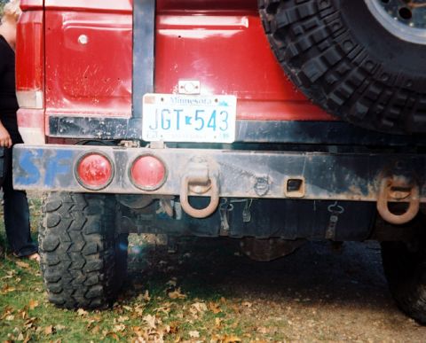 1989 Ford Bronco - The rear of a red 1989 Ford Bronco is shown, a spare tire and a Minnesota license plate.