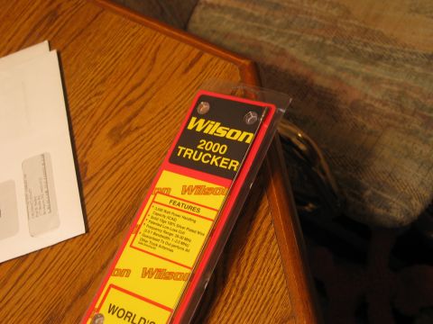 1995 Ford Bronco - Packaging for a Wilson 2000 Trucker antenna is shown on a wooden surface.