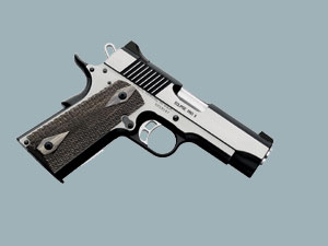 2002 Ford Taurus - A close-up view of a semi-automatic pistol against a plain background.