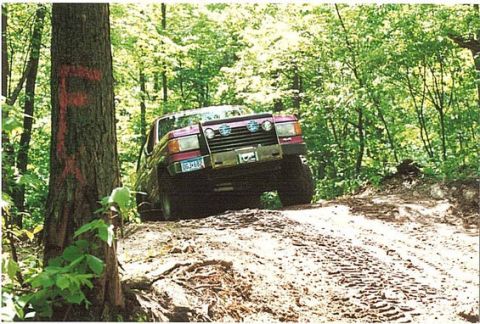 1989 Ford Bronco - This 1989 Ford Bronco navigates a muddy, wooded trail.